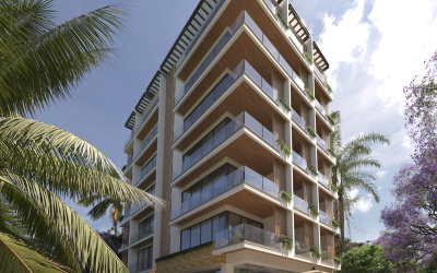 Una elegante fachada de desarrollo residencial frente al mar, ubicada en el corazón de la famosa Quinta Avenida en Playa del Carmen. Este edificio de diseño contemporáneo se caracteriza por sus líneas limpias y acabados en tonos naturales que se integran armoniosamente con el entorno